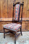 A Victorian rosewood prie dieu  side chair, tapestry upholstered back and seat, turned legs, c.1860