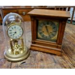 A  German oak  mantel clock, silvered dial, Roman numerals, twin winding holes, 29cm  high, c.1890;