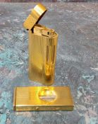 A gold plated Dunhill lighter, model no. A50077 and a gold plated German Dominus cigar cutter (2)