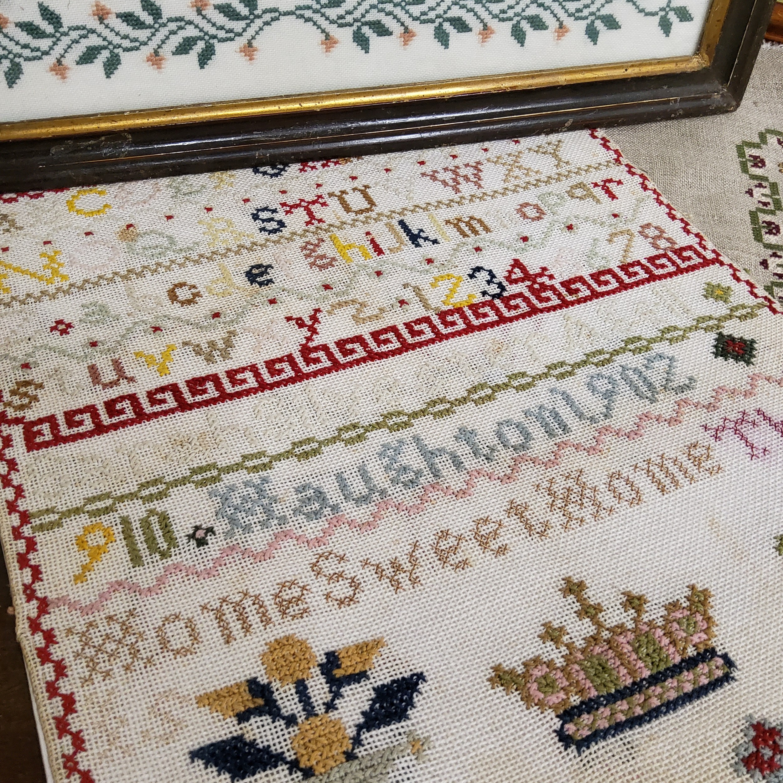 A Victorian sampler, embroidered by Wendy Anne Gorser 1898, with alphabet, stag, deer, trees, - Image 2 of 4