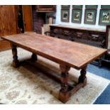 A 19th century English oak Refectory dining table, cup and cover legs, central refectory H