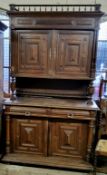 A substantial Victorian oak block front side cabinet, galleried cresting above two block fronted