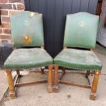 A pair of early 20th century oak Sheffield chamber of commerce hall chairs in green leather