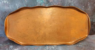 An Arts and Crafts Newlyn style copper shaped gallery tray, chased with stylised sinuous whiplash