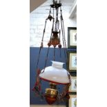 A 19th century ceiling oil lamp, later painted in red and gilt, opaque domed shade, weighted rise