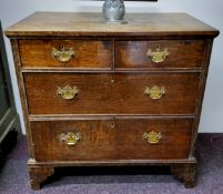 A George III English oak bachelor's chest of twoshort above two long drawers, bracket feet c.1800