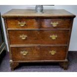 A George III English oak bachelor's chest of twoshort above two long drawers, bracket feet c.1800