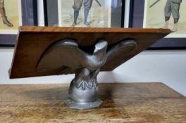 An Anglican Church chrome plated eagle lectern, the eagle 27cm high;  a mahogany oval mirror, barber