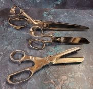 A pair of French drapers scissors,  indistinctly stamped, 34.5cm, early 20th century;  a pair of