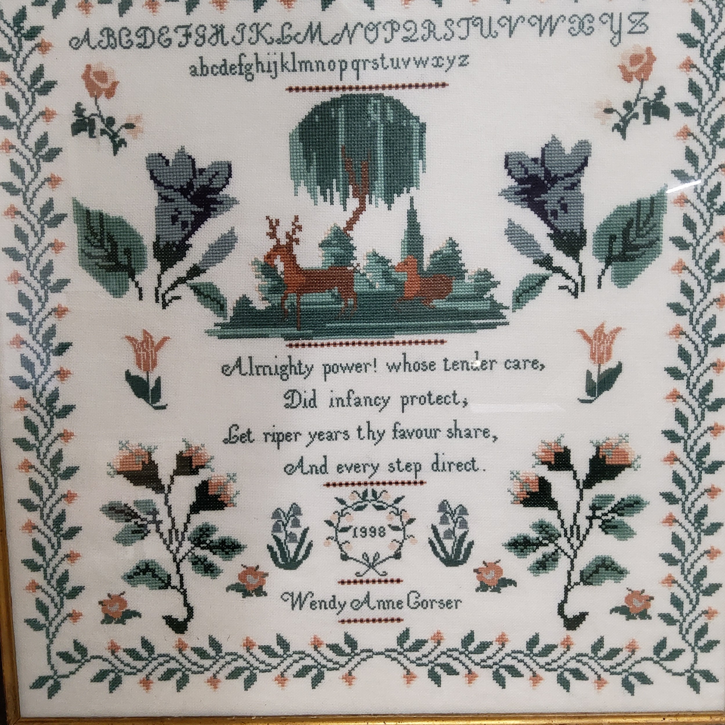 A Victorian sampler, embroidered by Wendy Anne Gorser 1898, with alphabet, stag, deer, trees, - Image 3 of 4