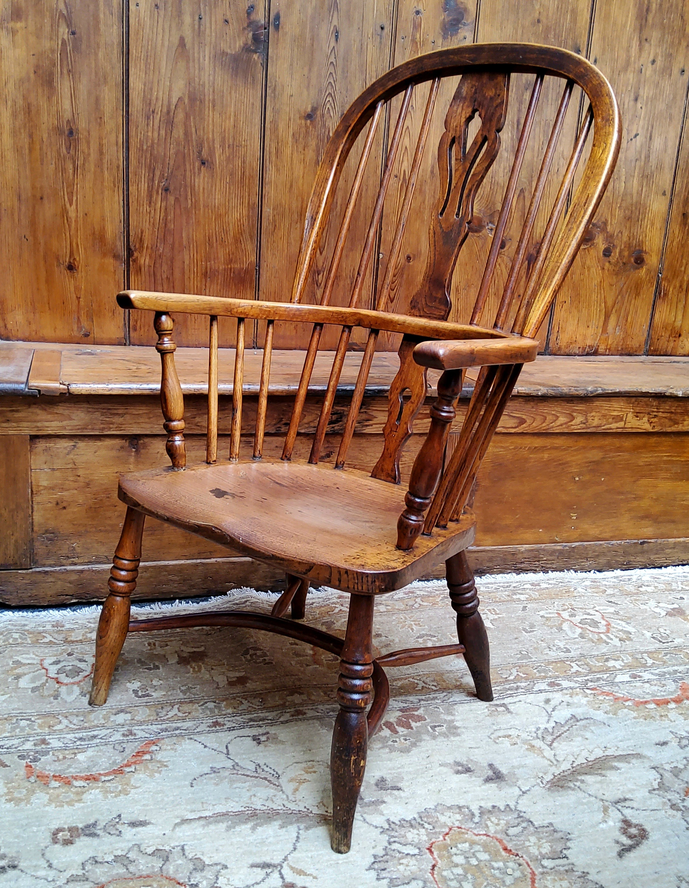 An early 19th century ash and elm Windsor chair with crinoline stretcher c.1820
