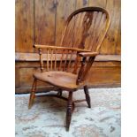 An early 19th century ash and elm Windsor chair with crinoline stretcher c.1820