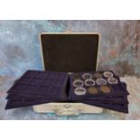 A Leuchtturn aluminium coin collectors case enclosing six coin trays.