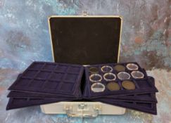 A Leuchtturn aluminium coin collectors case enclosing six coin trays.
