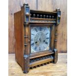 An Arts and Crafts mahogany mantel clock, silver dial with Roman numeral, the rectangular case