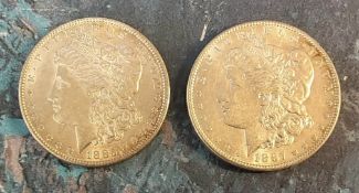 An 1885 American One Dollar; another 1887 (2)