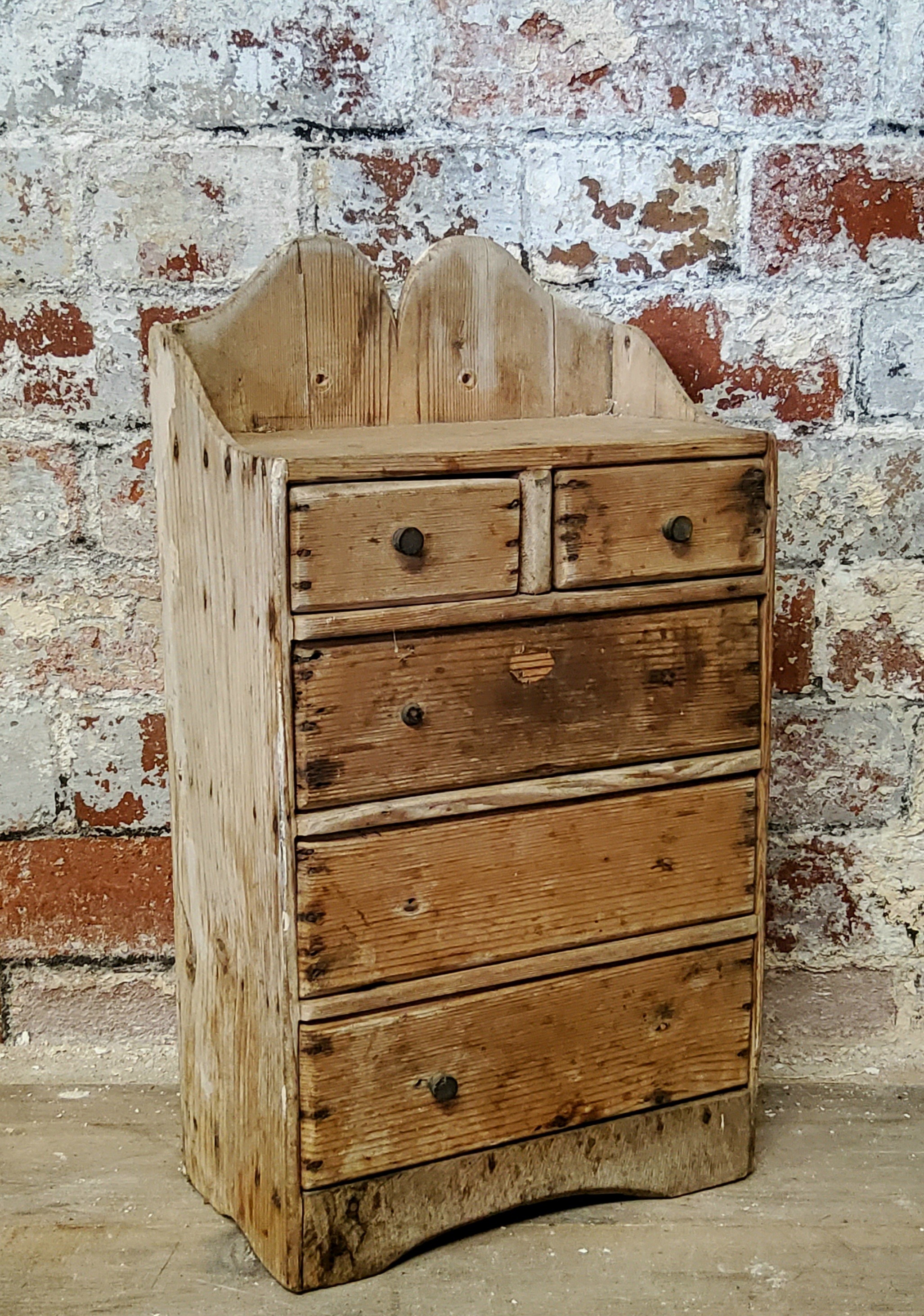 A rustic 19th century farmhouse pine spice rack of two above three drawers c.1880