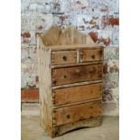 A rustic 19th century farmhouse pine spice rack of two above three drawers c.1880