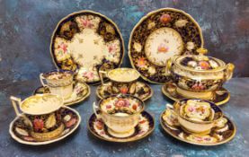 A mid 19th century English sucrier, cover and stand, two teacups and plate, possibly Ridgways,