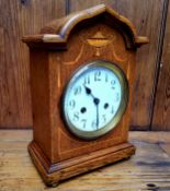 An oak bracket clock, Junghans B11 strike movement, white enamel dial, Arabic numerals, twin