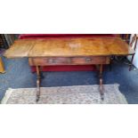 A Regency style sofa table, two short drawers to frieze, brass lion paw feet