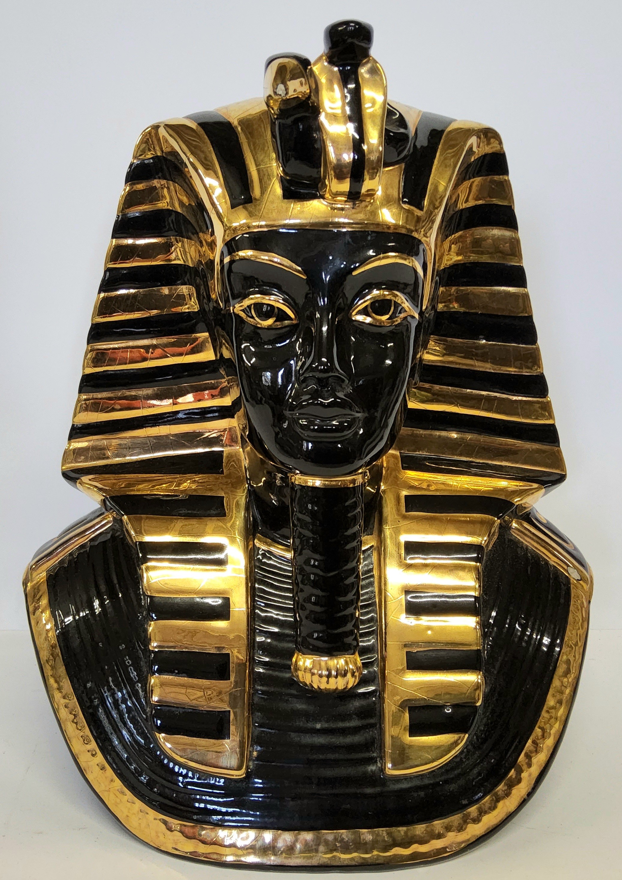 A large ceramic Tutankhamun pharaoh mask, moorish black and gold glaze, 34cm high