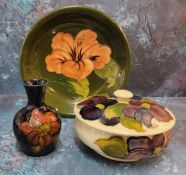 A Moorcroft dish 'Hibicus' pattern on green ground, impressed marks, signature and puce paper label,