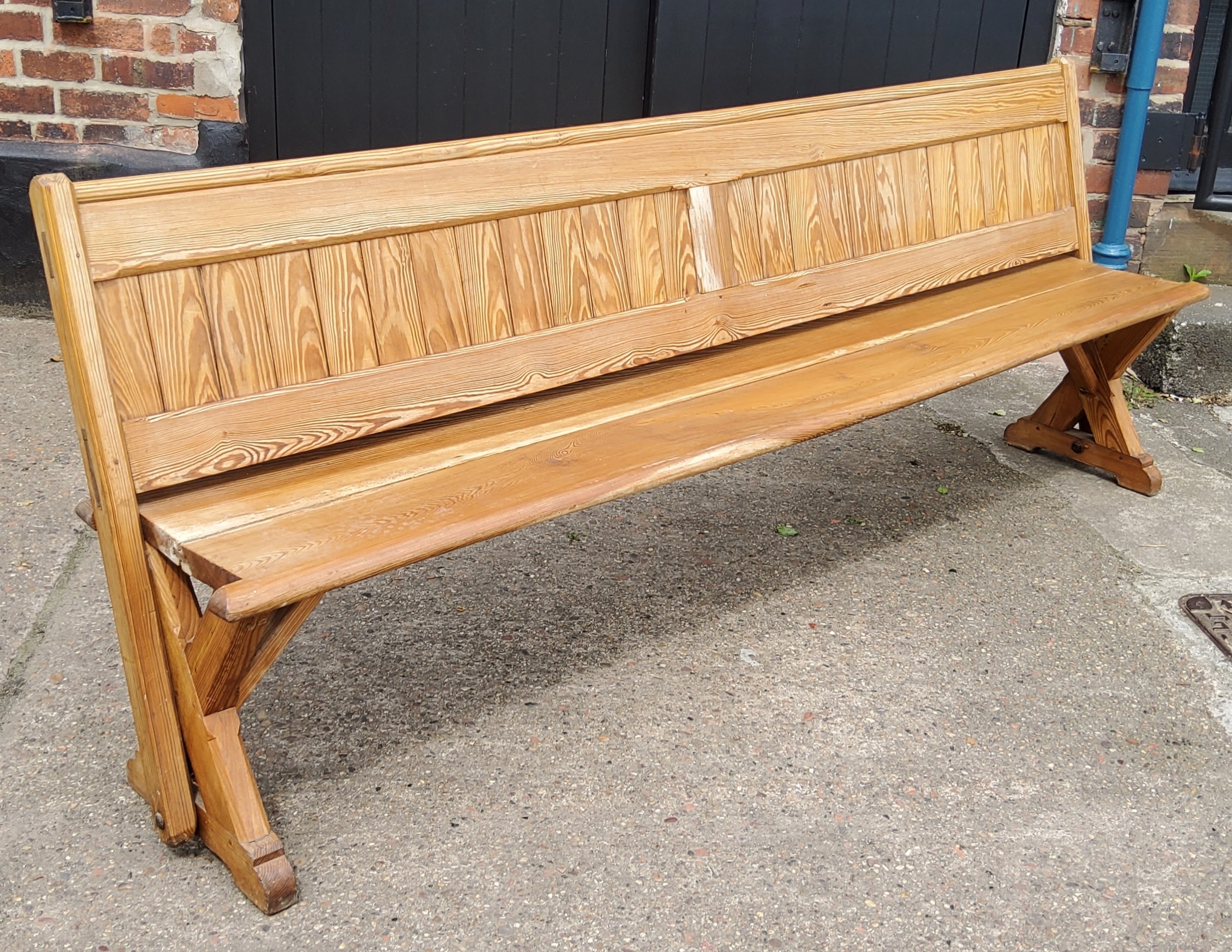 A Victorian pitch pine church pew/ tram seat, reversible slatted back, 240cm long, c,1860.  Note: - Image 2 of 4