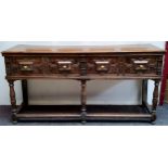 A Charles II Revival oak block front dresser base, moulded rectangular top, the frieze fitted with