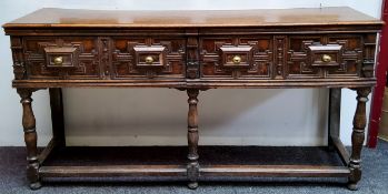 A Charles II Revival oak block front dresser base, moulded rectangular top, the frieze fitted with