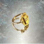 An unusual Victorian 18ct gold ring the large shaped setting centrally set with round diamond