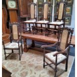 A set of five early 20th century oak dining chairs, including two elbow chairs, bergere backs