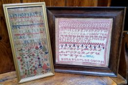 A Victorian needlework sampler, embroidered with alphabet, numbers, acorns and foliage, dated