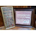 A Victorian needlework sampler, embroidered with alphabet, numbers, acorns and foliage, dated