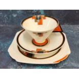 A Shelley Art Deco Vogue Orange Block pattern teacup, saucer and side plate, triangular handle,