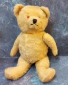 A mid 20th century musical jointed mohair bear, 42cm high, c.1940