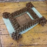 An unusual Prisoner of War wooden photograph frame, constructed from split pegs, 50cm x 44cm