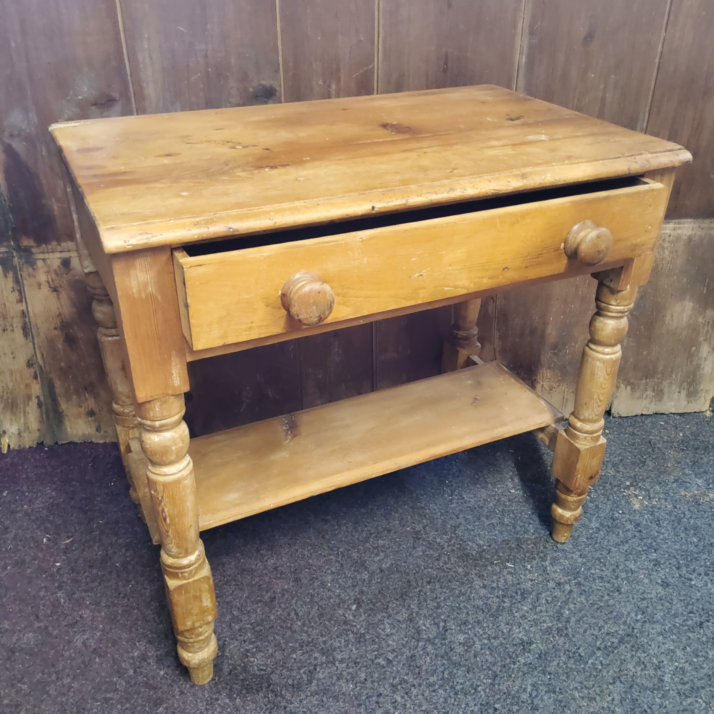 A Victorian pine side table, drawer to frieze, shelf stretcher, turned legs, 76cm high, 77cm deep,