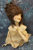 An early 20th century German Boudoir half doll, brown wig, open mouth, 15cm high, triangle mark