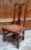 An early 18th century Queen Anne golden oak side chair, pierced vasular splat, solid seat, turned