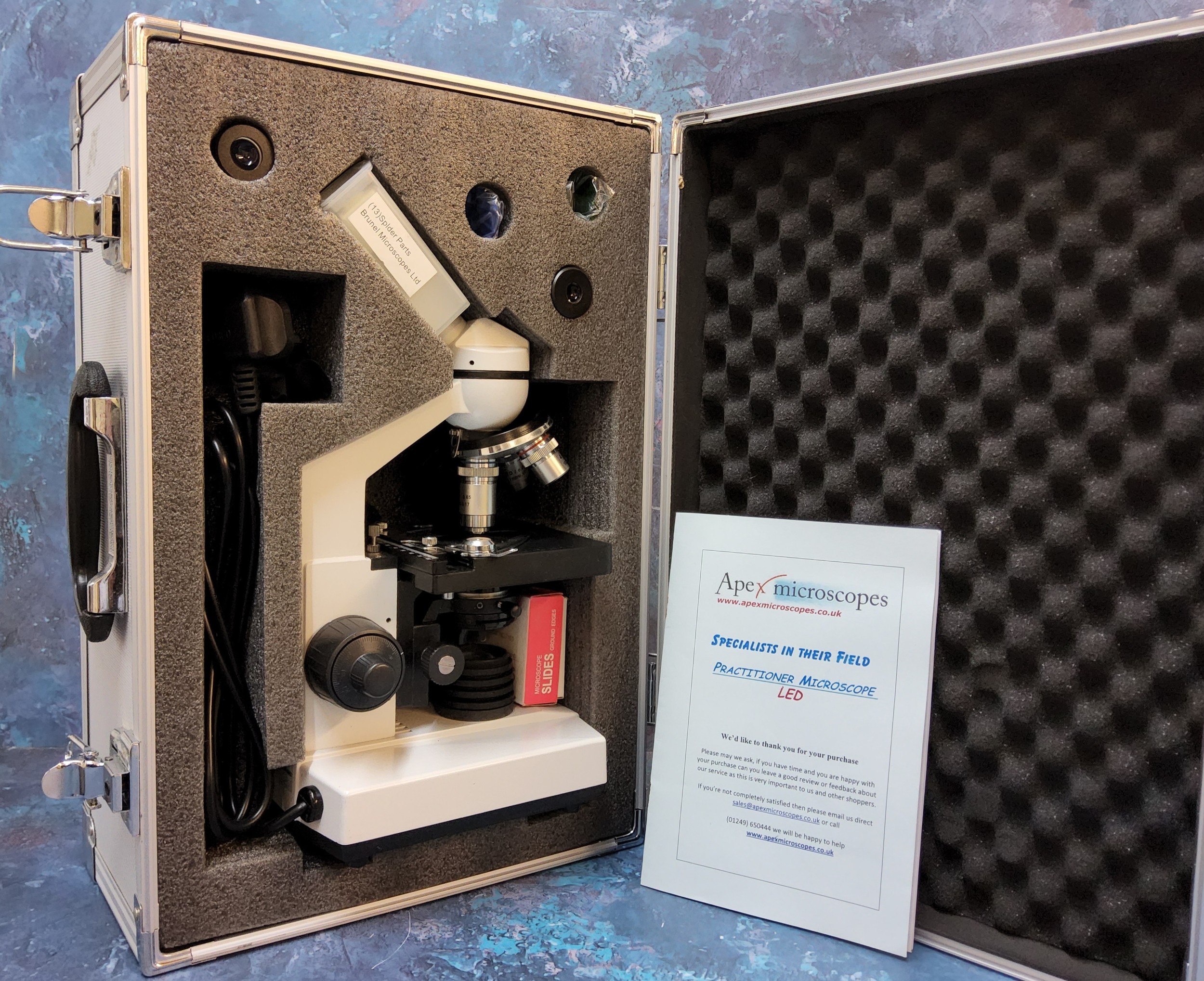 An Apex practitioner microscope LED complete with accessories in original fitted aluminium carry