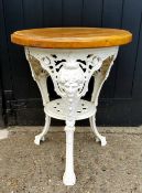 A Victorian cast iron pub table, bold mask capped trio with pierced circular under tier, later