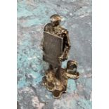 A novelty silver place card/menu holder,   cast as a man with a sandwich board, advertising shows on