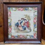 A Victorian woolwork tapestry, embroidered with two Scottish boys and a dog, meandering floral