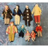 Nine German dolls' house dolls - all bisque and shoulder  head, croquet and felt clothes,  largest