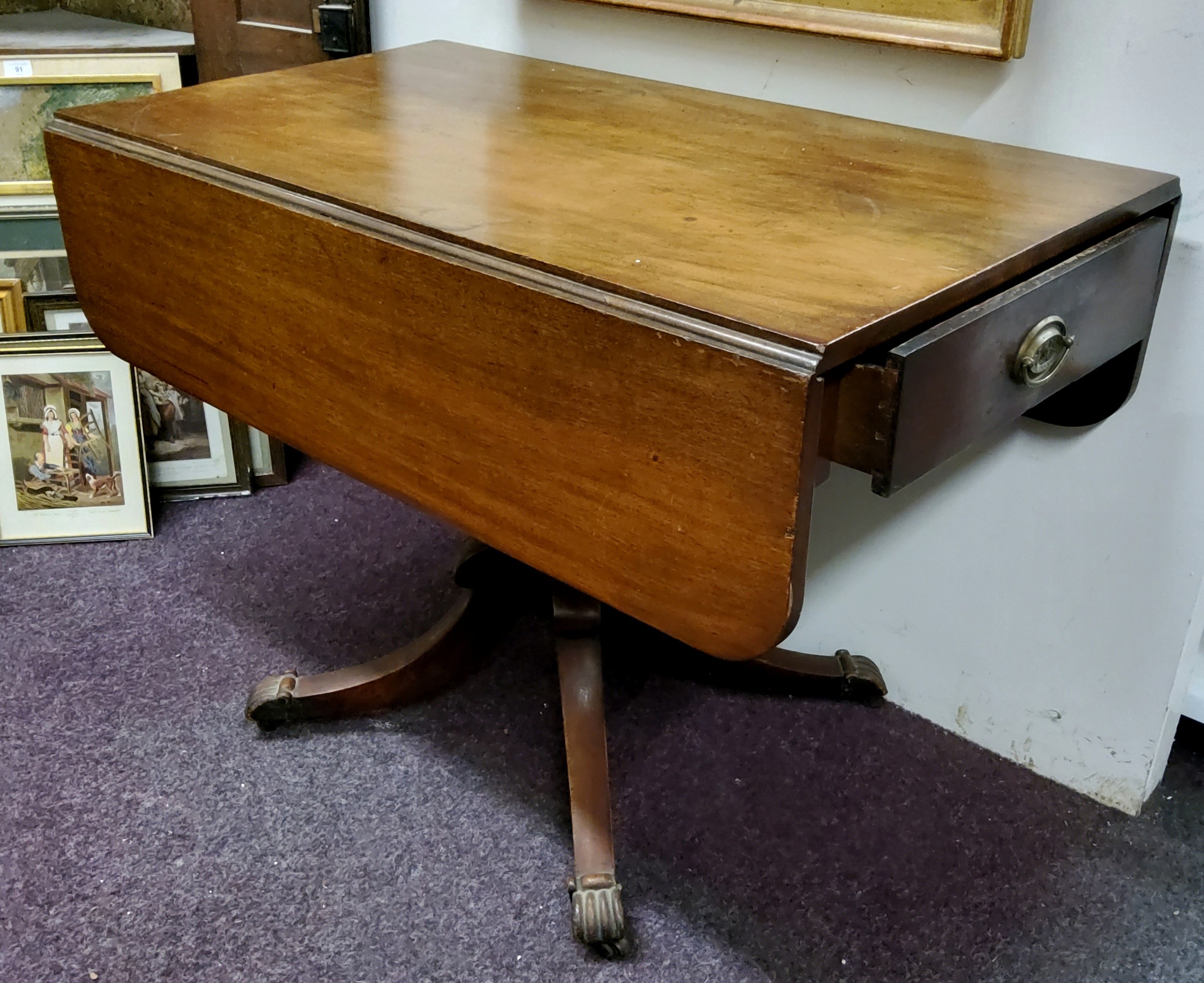 A 19th century mahogany Pembroke table, drawer to frieze, blind to verso, rounded rectangular top,