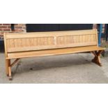 A Victorian pitch pine church pew/ tram seat, reversible slatted back, 240cm long, c,1860.  Note: