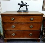 A George III mahogany chest, of three long cock beaded drawers, bracket feet, 88cm high, 104.5cm