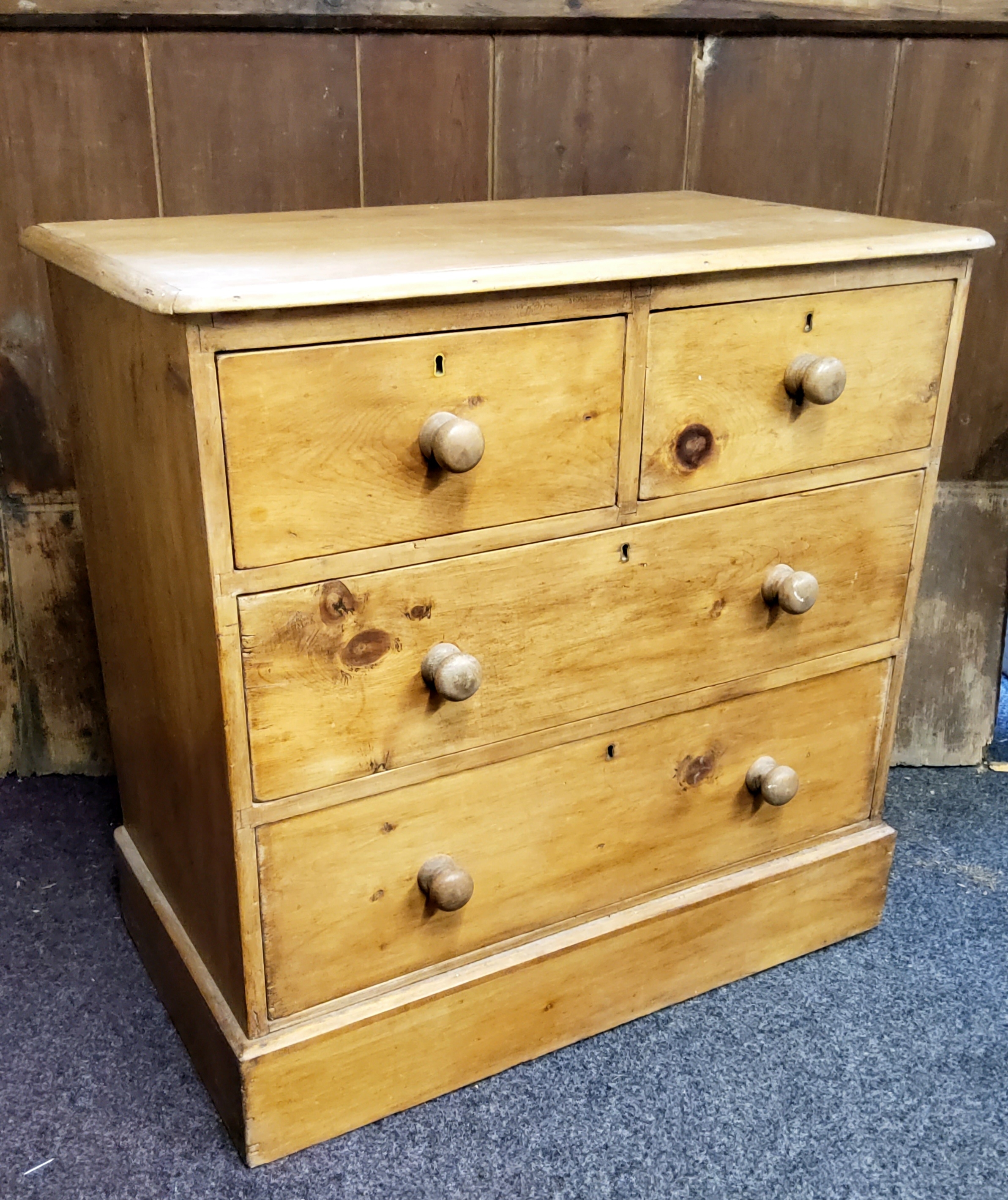 A Victorian pine chest, of two short and two long drawers, plinth base, 87cm high, 90cm wide, 50cm