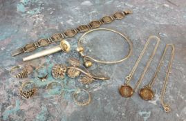 A sterling silver posy holder lapel brooch; silver modernist rings; St. Christopher pendants;